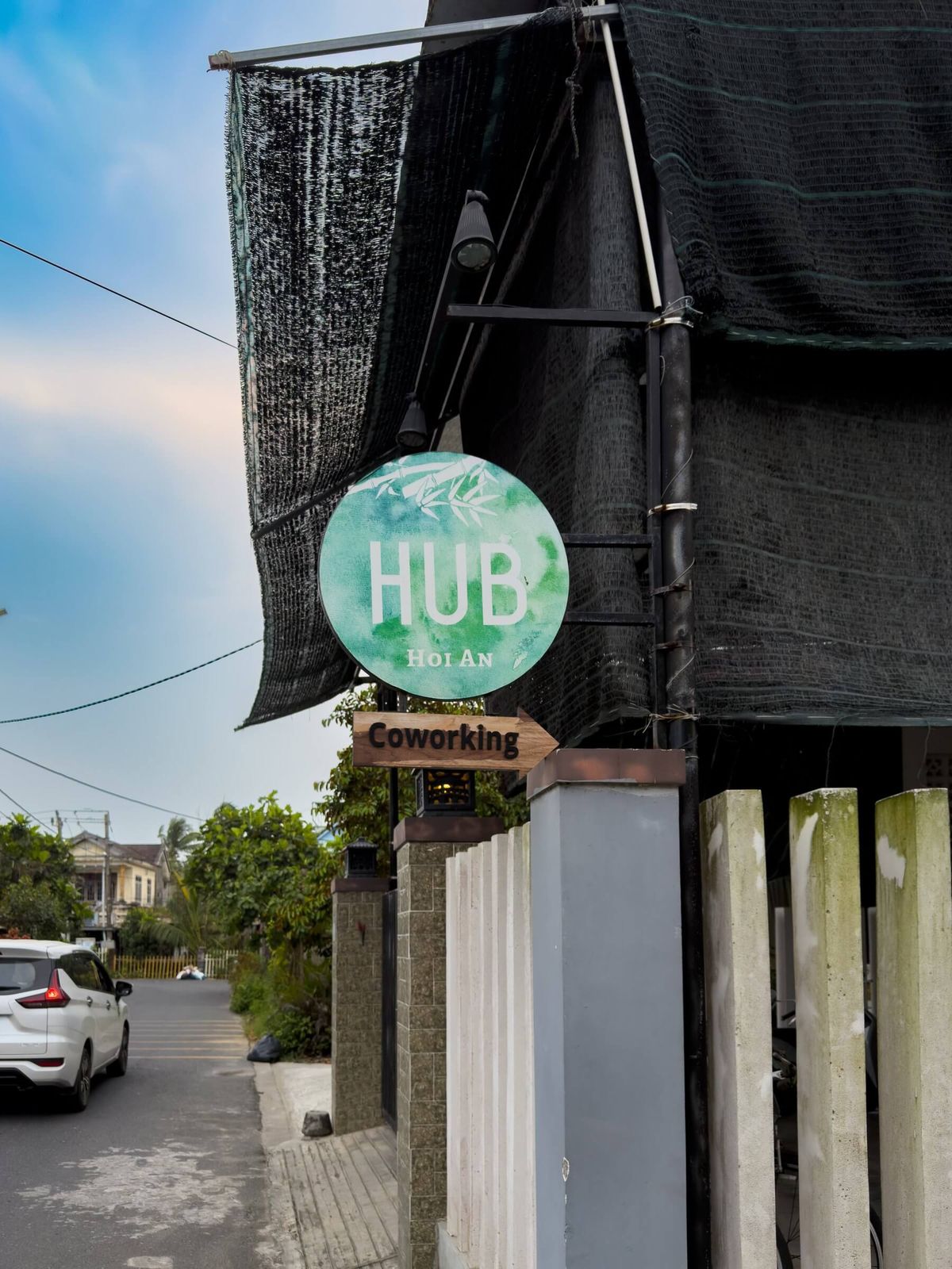 Hub Hoi An coworking space sign with an arrow, Vietnam