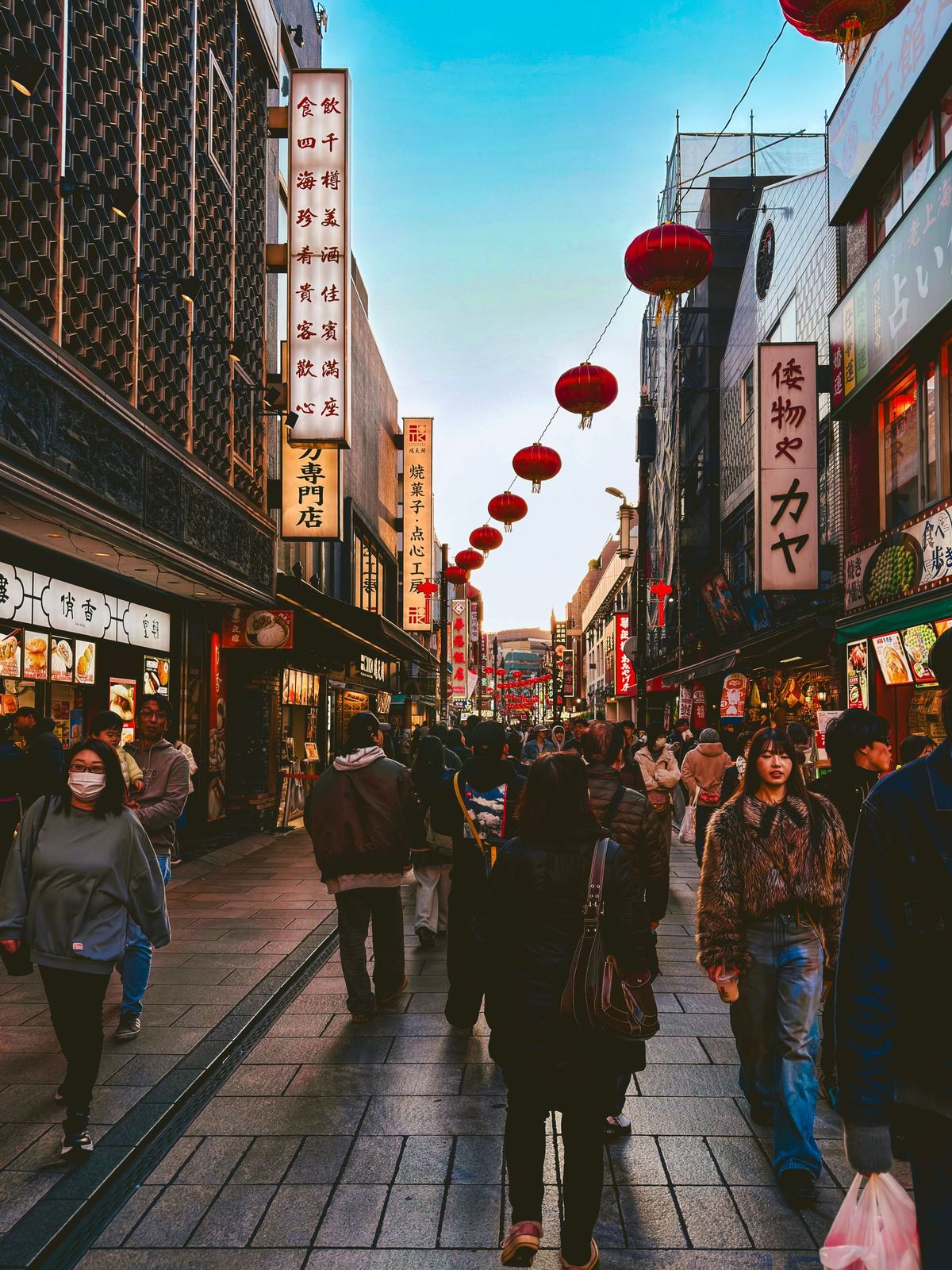 A busy street in Yokohama Chinatown at dusk